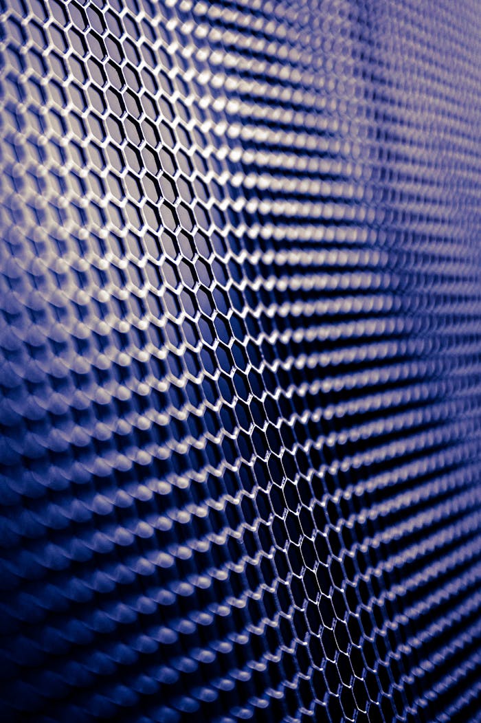 Crafting Captivating Headlines: Your awesome post title goes here Close-up of a futuristic metallic hexagonal pattern, perfect for tech designs.